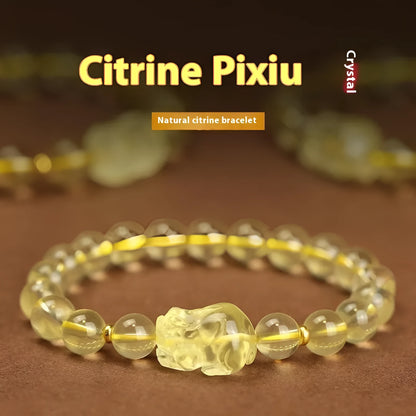 Yellow artificial crystal Pi Xiu charm on a leather bracelet, shown with different bead size options.