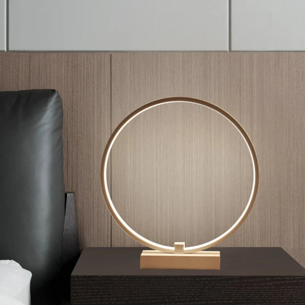 Modern 25cm diameter white LED bedside lamp with acrylic frame and iron base, emitting cool or warm white flicker-free light