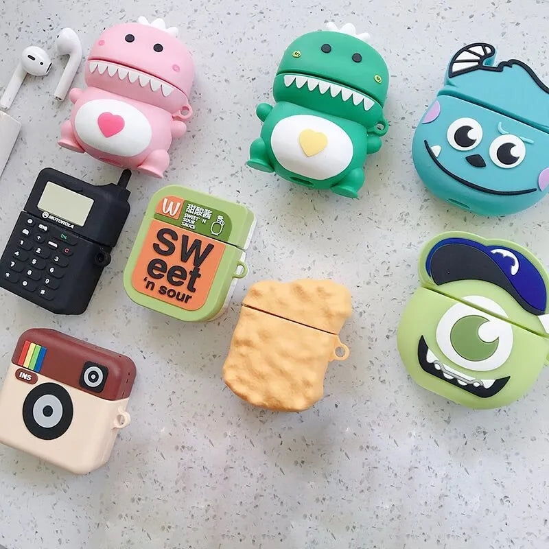 Green silicone AirPods case with raised cartoon animal design, showing charging port cutout.