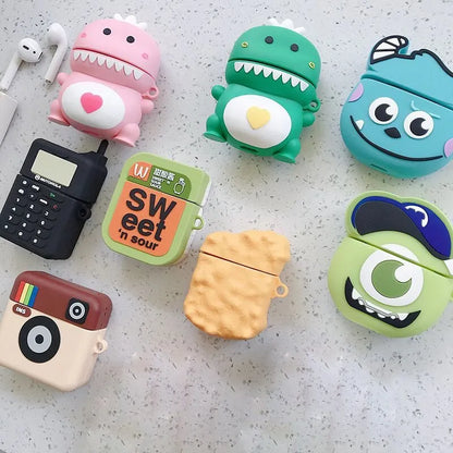 Green silicone AirPods case with raised cartoon animal design, showing charging port cutout.