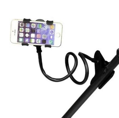 Black flexible long arm phone holder with V-clip gripping a smartphone, bent to position screen for bedside viewing.