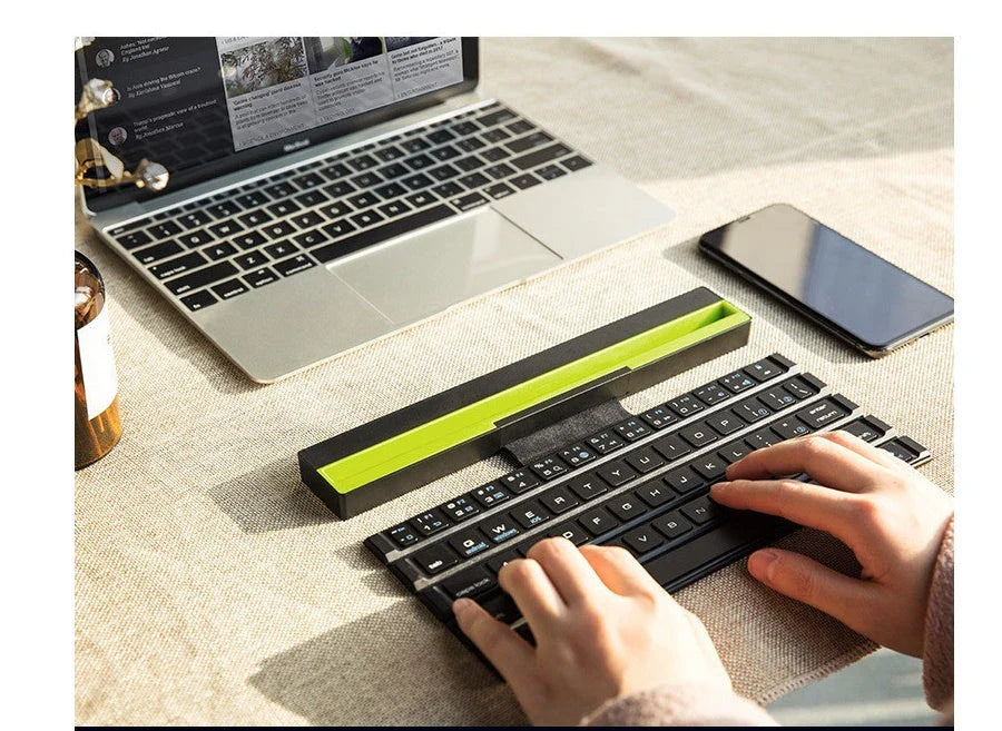 Wireless folding keyboard with Broadcom Bluetooth technology for portable office use