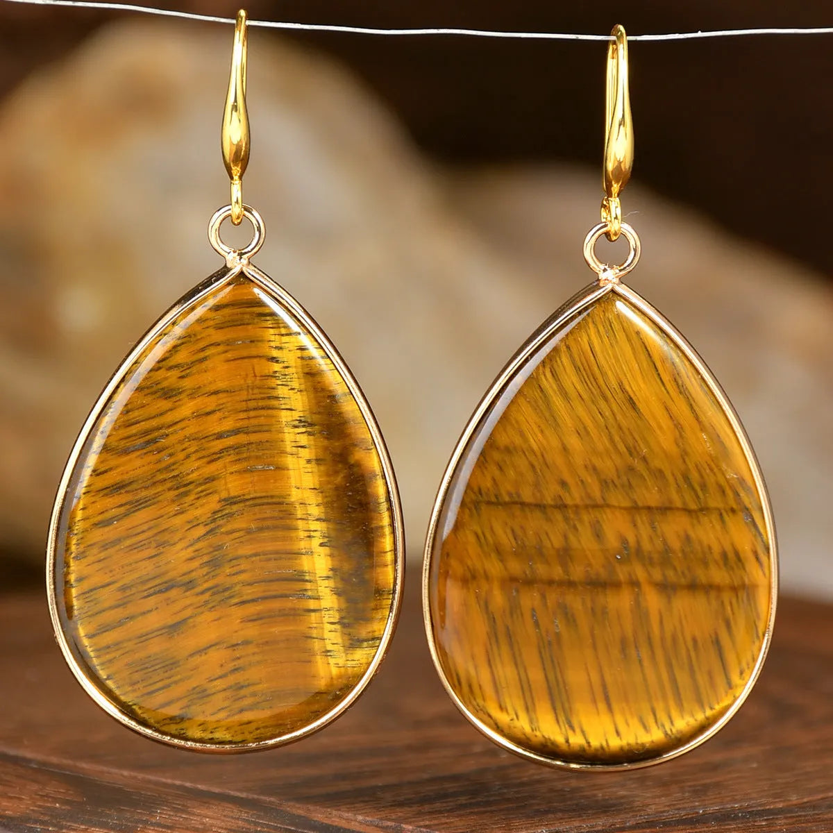 Women's retro-style drop earrings with a natural stone pendant in a water drop shape on an electroplated setting.