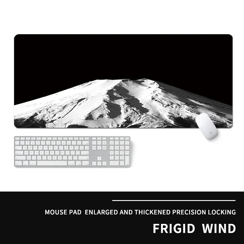 Oversized rectangular mouse pad with a printed design on a desk, next to a keyboard and mouse.