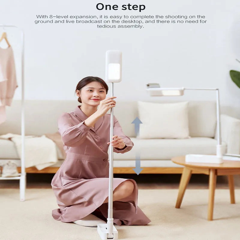 Pink floor-standing fill light with telescopic aluminium alloy stand and wireless remote for mobile phone live streaming.