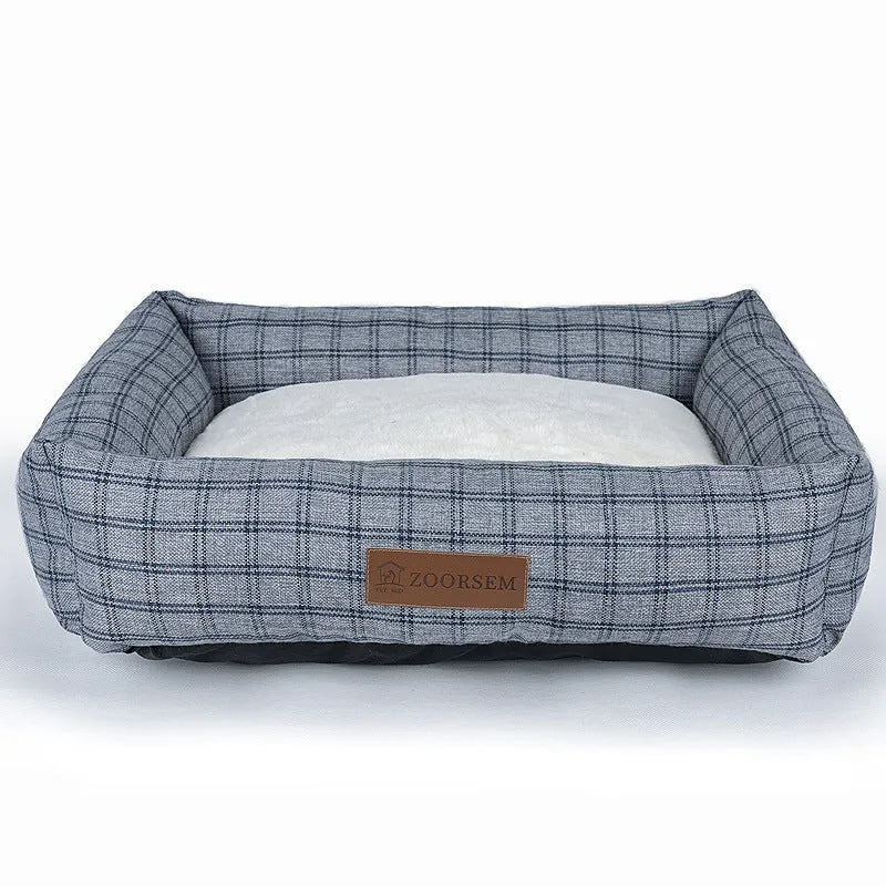 Grey linen-look square dog bed for medium-sized dogs on a wooden floor