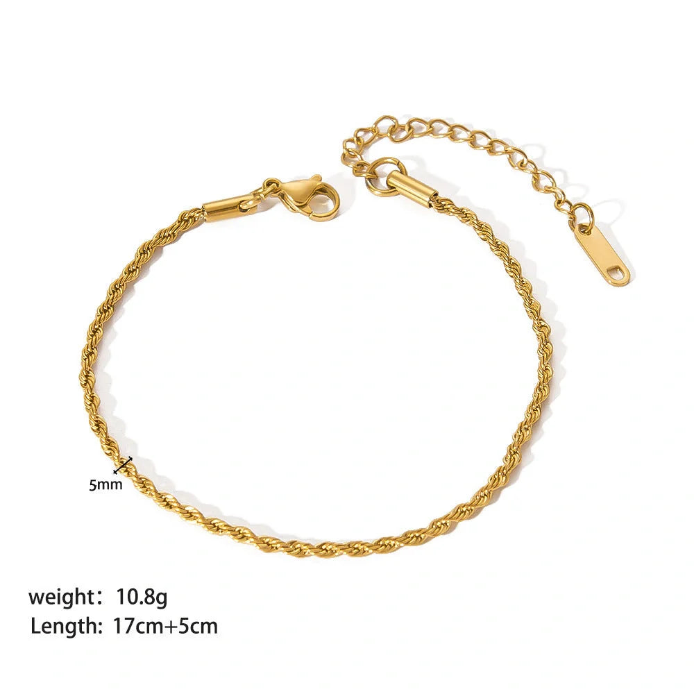 Elegant stainless steel bracelet with a sleek geometric design, gold-plated finish, and unisex style suitable for any occasion.