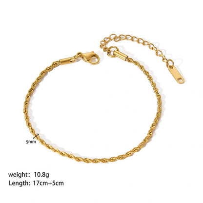 Elegant stainless steel bracelet with a sleek geometric design, gold-plated finish, and unisex style suitable for any occasion.