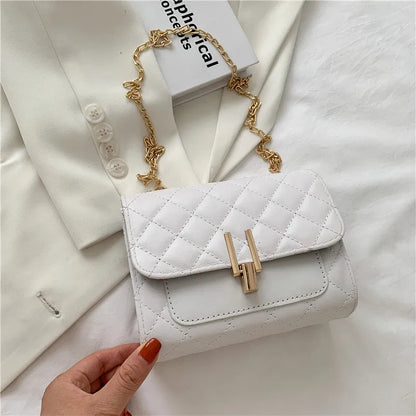 Minimalist women's crossbody bag in vegan PU leather with a diamond lattice chain strap.