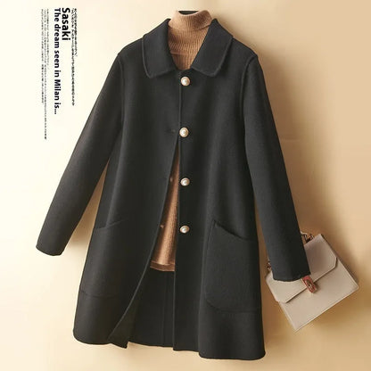 Women's double-faced wool mid-length coat with a doll collar and pearl buckle detail in a solid colour.