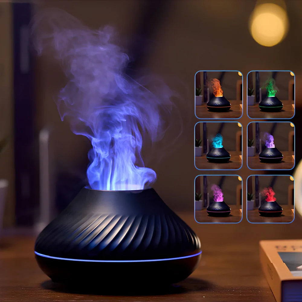 Black RGB flame aroma diffuser 130ml showing 3D colourful volcano mist effect on table