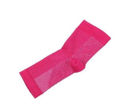 Anti-fatigue compression foot sleeve in black, red, or white, featuring moisture-wicking fabric and a heel hole for breathability.
