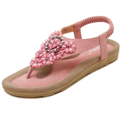 Women's flat sandals with floral rhinestone detail, open side, elastic ankle strap, apricot colour