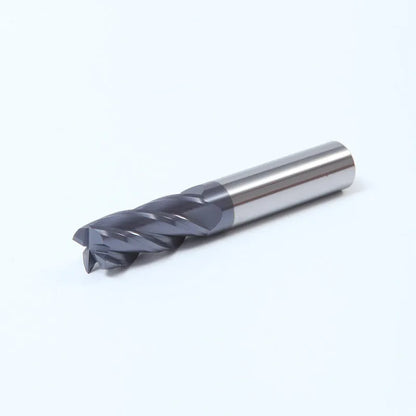Set of straight shank carbide spiral milling cutters in various sizes on a workshop bench.