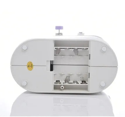 Compact white mini electric household sewing machine with work light and thread cutter.