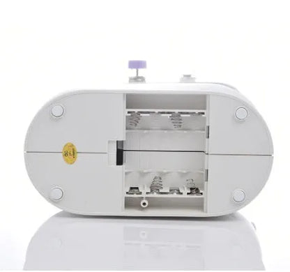 Compact white mini electric household sewing machine with work light and thread cutter.
