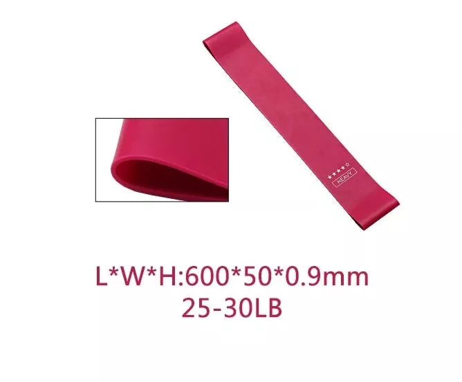 Yoga tension band set in five colours with varying resistance levels for fitness and Pilates