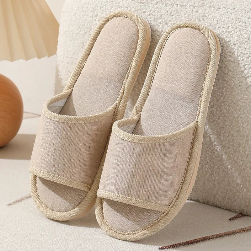 Women's open-toe linen slippers with thick sole in light brown colour.