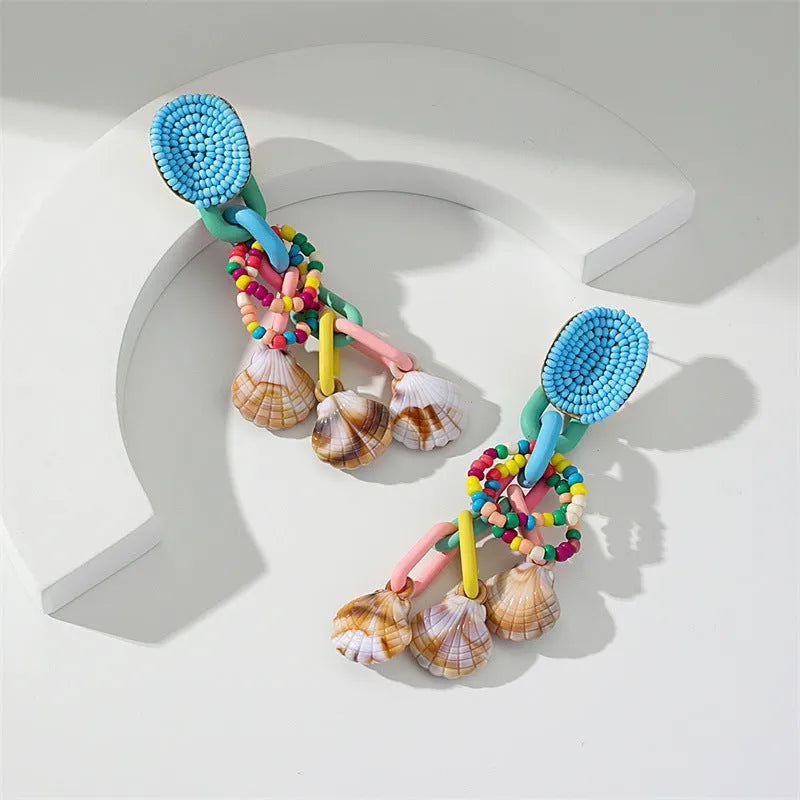 Handmade bohemian shell tassel earrings for women with colourful flower and geometric drop design
