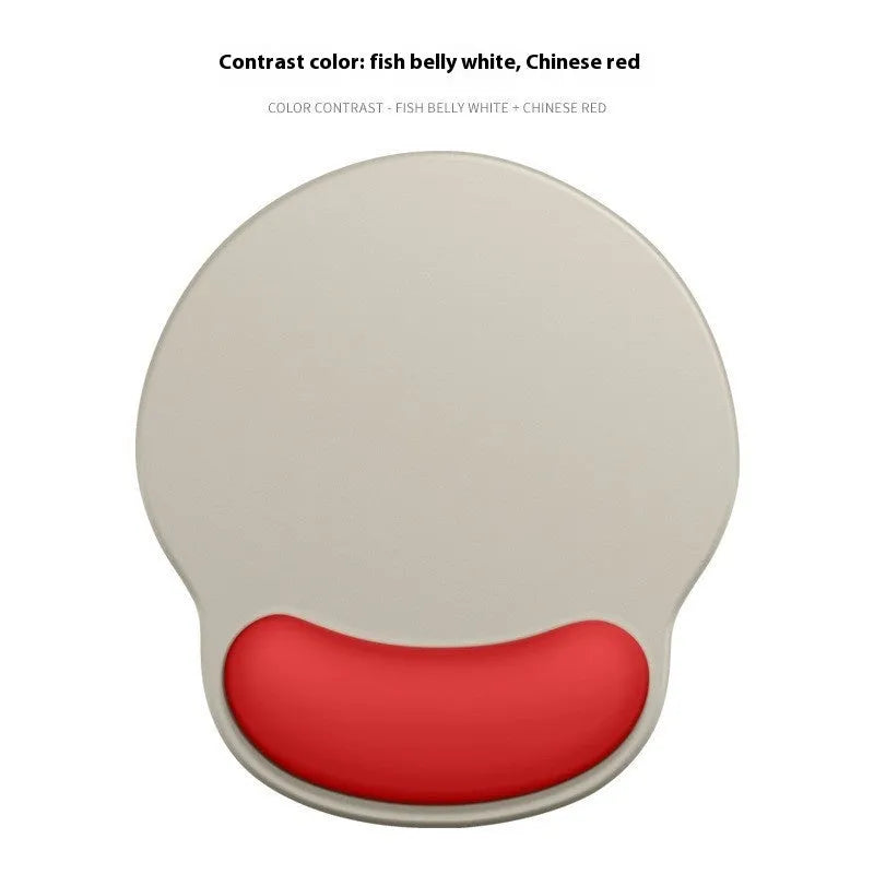 Silicone mouse mat with integrated wrist rest in a gradient blue black colour on a desk.