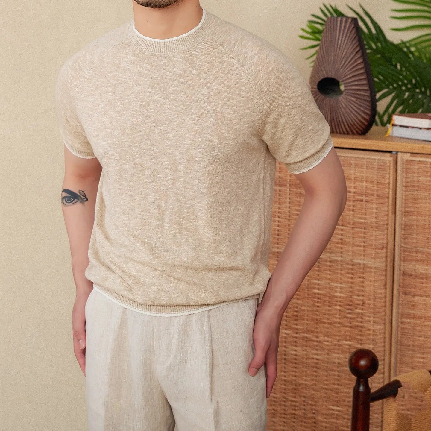 Brown linen-cotton blend casual T-shirt with round neck and short sleeves on a hanger