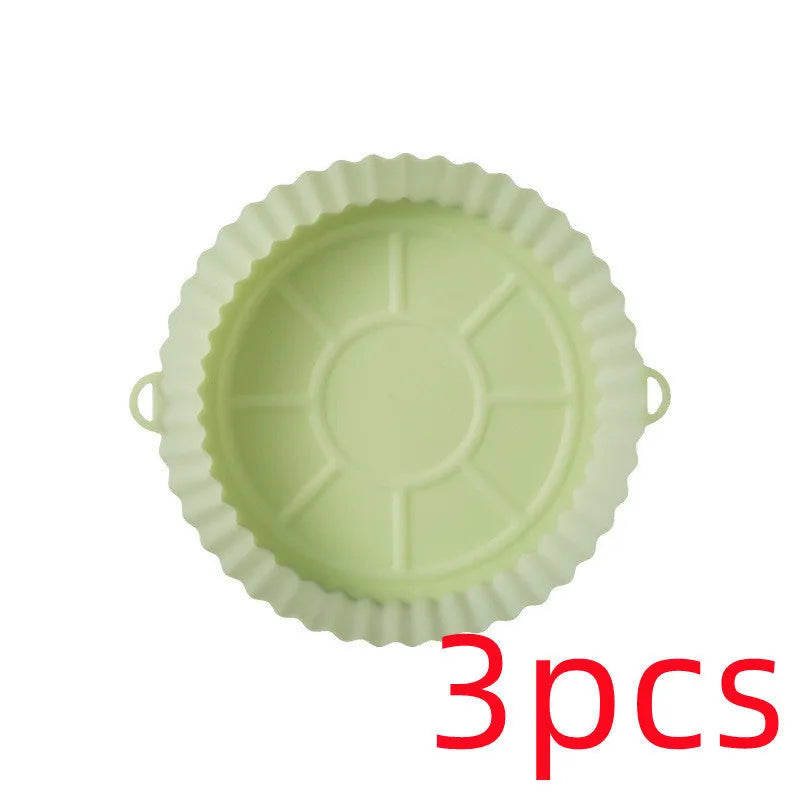 Round blue silicone baking tray mat with 4.5cm sides on a kitchen counter.