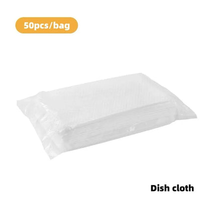 Magic disposable cleaning brush with handle, storage box, and pack of 50 white non-woven cloths for bathroom and kitchen cleaning.