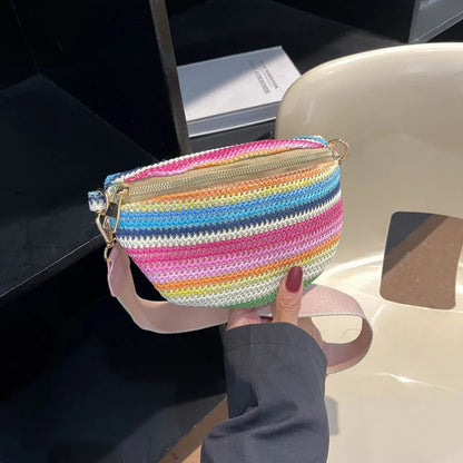 Blue and pink woven straw beach bag with single shoulder strap and zipper compartment