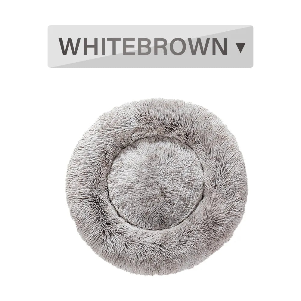 Fluffy donut-shaped pet bed with raised bolster edge in long plush material
