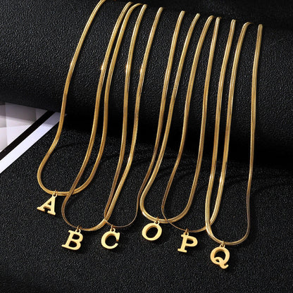 Elegant gold A-Z letter pendant necklace on a snake chain