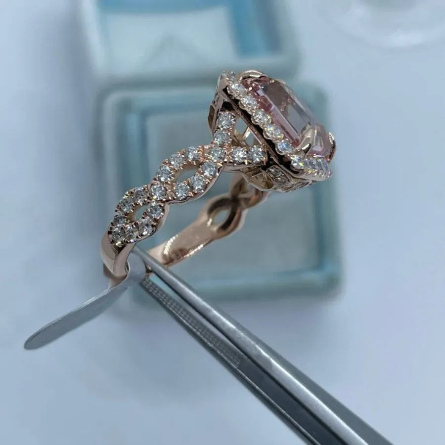 Rose gold geometric alloy ring showing electroplated finish and structured shape.