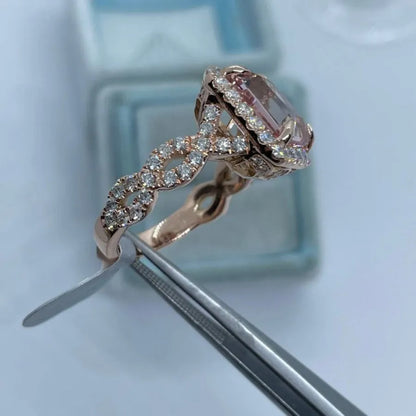 Rose gold geometric alloy ring showing electroplated finish and structured shape.