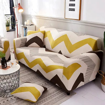 Printed stretchable sofa slipcover with geometric abstraction pattern on a three-seater sofa, showing tight fit and modern design.