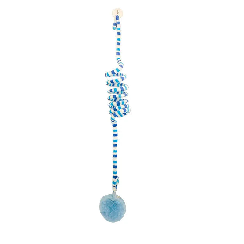 Hanging cat toy with spring, bell, and inflatable ball attached to a door via a suction cup.