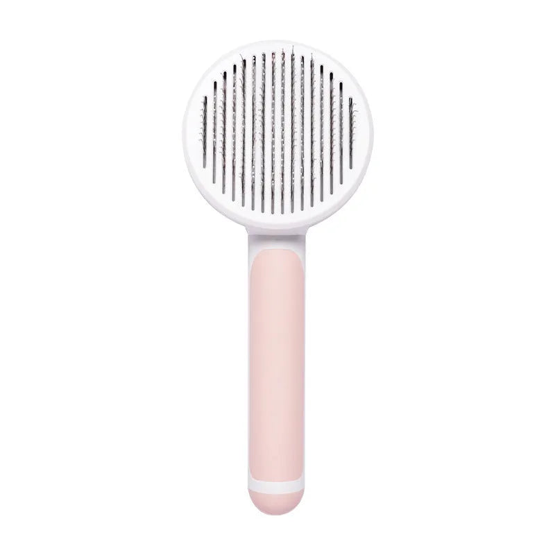 Hand-held pumpkin-coloured pet brush with stainless steel needles for grooming cats and dogs