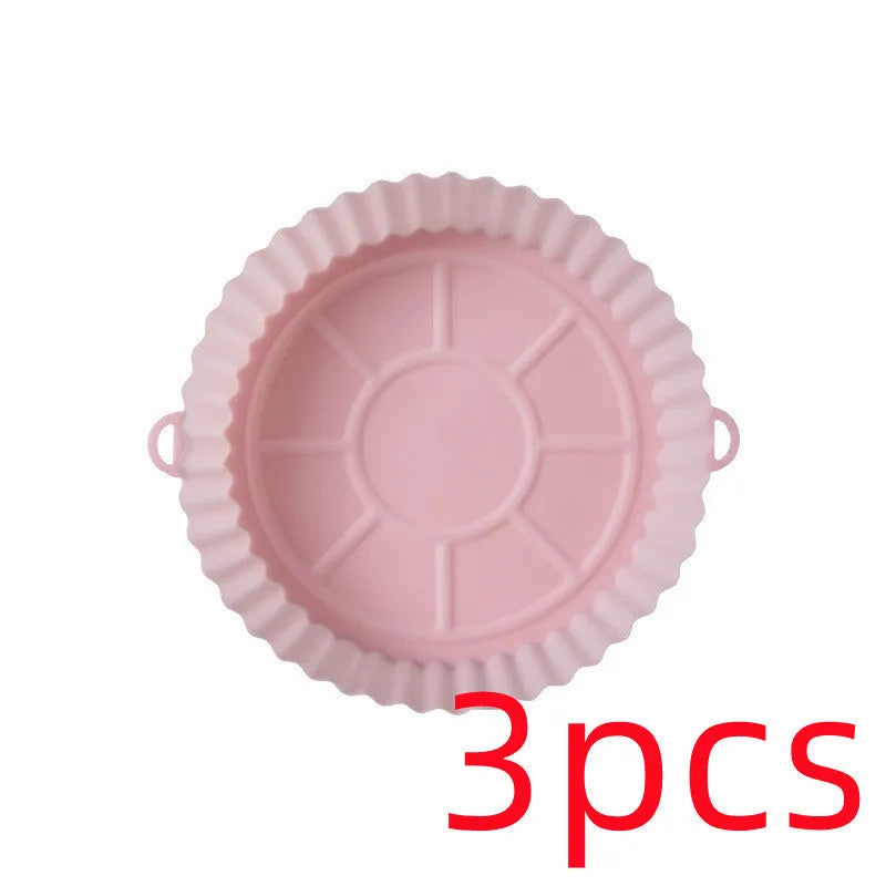 Round blue silicone baking tray mat with 4.5cm sides on a kitchen counter.