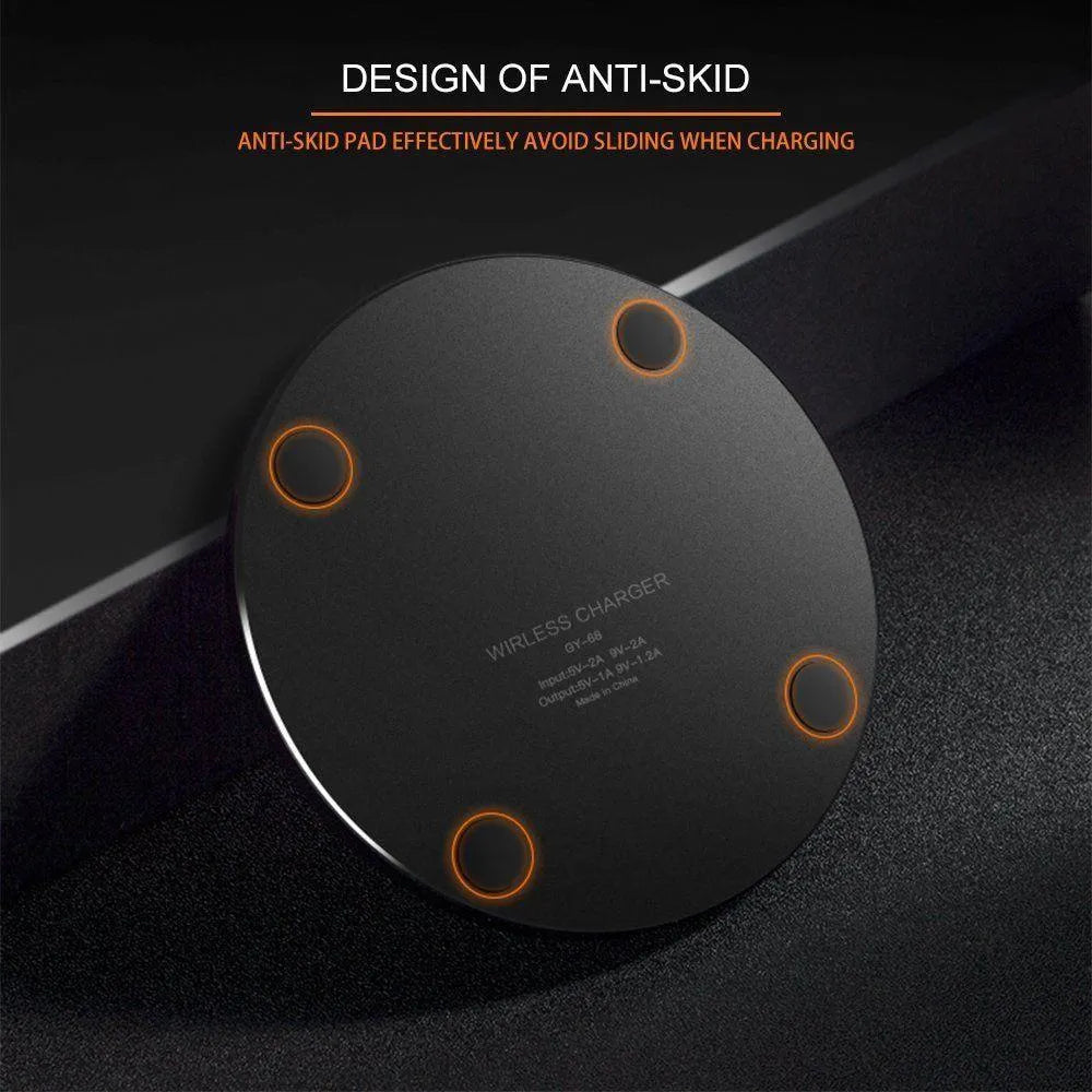 Black ultra-thin square wireless fast charging pad for phones on a desk