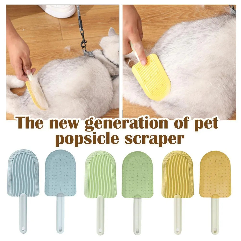 Foldable blue pet grooming brush with silicone teeth on a white background