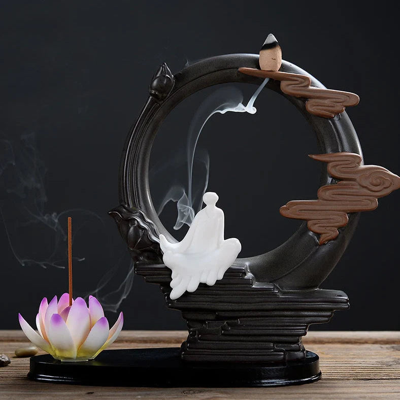 Purple clay tea pet ornament with downward flowing incense smoke and warm LED illumination