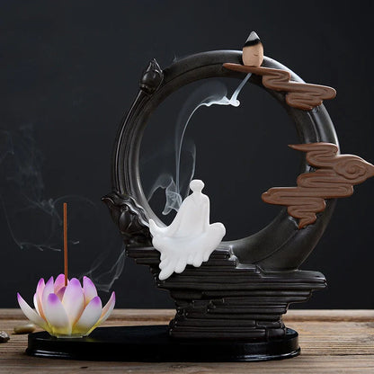 Purple clay tea pet ornament with downward flowing incense smoke and warm LED illumination