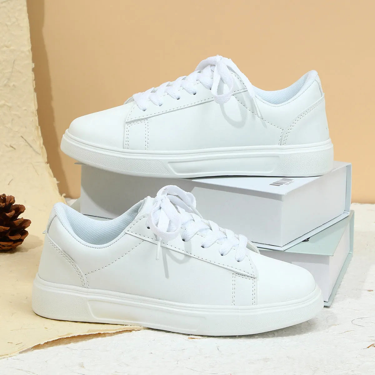 Casual beige brown platform skateboard sneakers with a low-top PU upper, round toe, and cross-strap detail