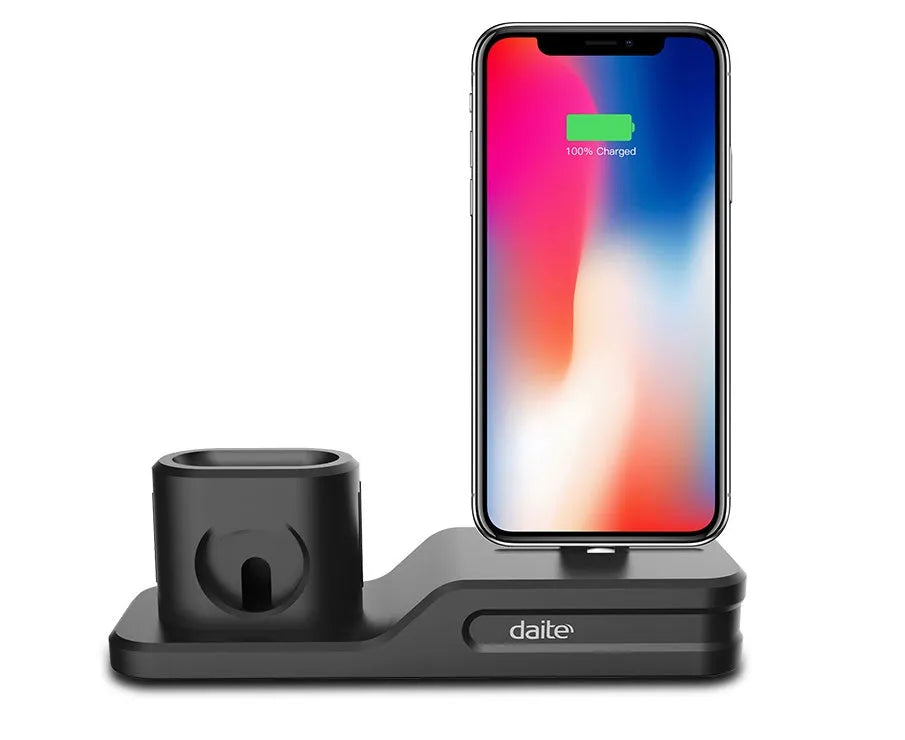 Black silicone 3-in-1 charging stand for Apple iPhone, Apple Watch, and AirPods on a desk