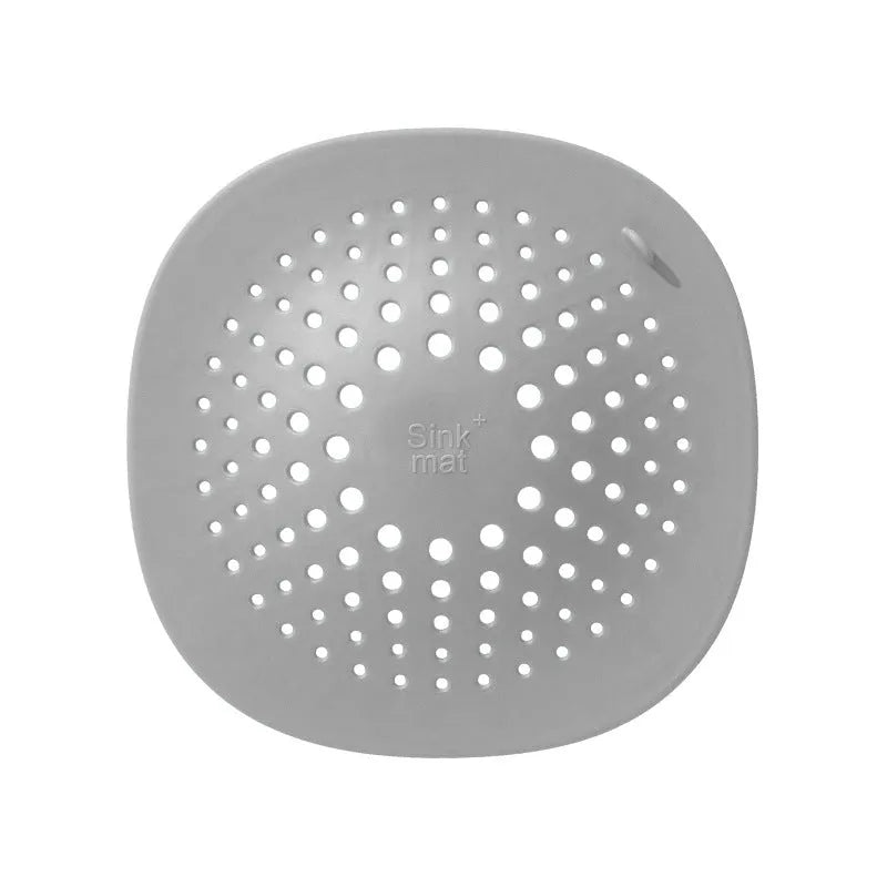 Square TPR rubber sink drain stopper measuring 145mm in dark grey, orange, white, green, and blue colour options
