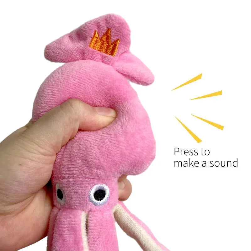 Pink squid-shaped corduroy plush dog toy with a squeaker.