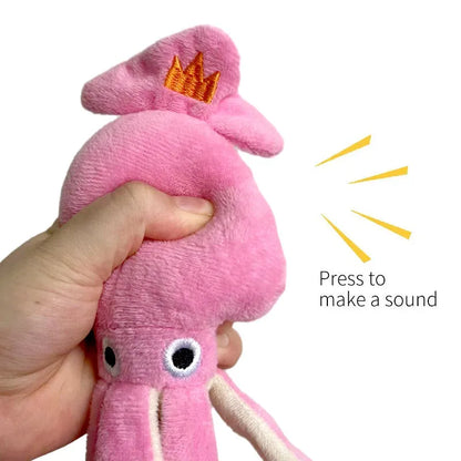 Pink squid-shaped corduroy plush dog toy with a squeaker.