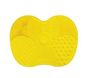 Silicone makeup brush cleaning pad, 15.5 x 12 cm, shown as a coloured brush cleaner mat for cleansing makeup brushes.