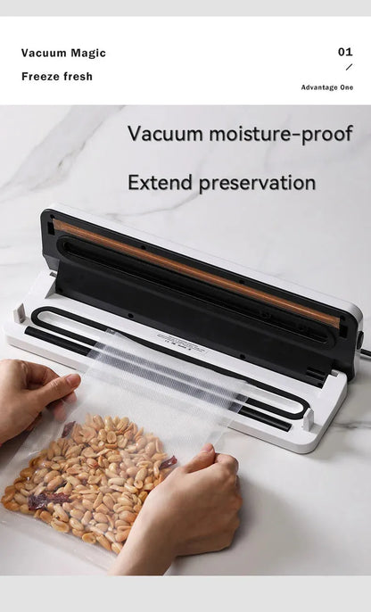 Black automatic vacuum sealer with 30cm sealing bar on kitchen counter next to vacuum-sealed food packages