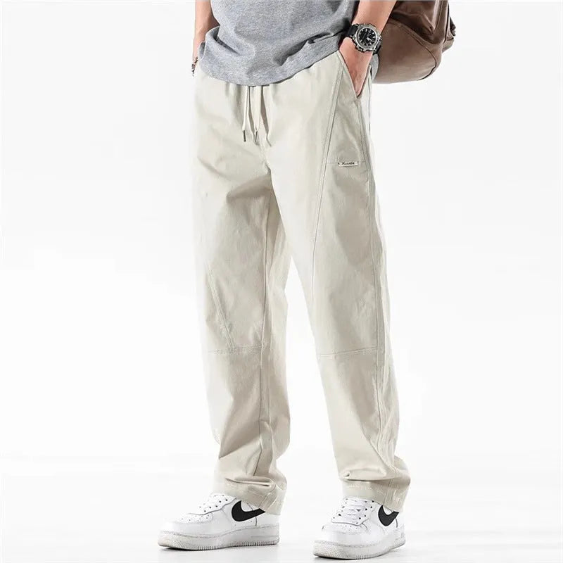 Cotton wide-leg trousers for women with elasticated waistband, antibacterial function and relaxed casual fit, available in beige or black in Asian sizing from M to 4XL.