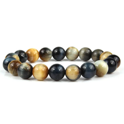 Natural tiger eye crystal bead bracelet showing round geometric beads on a wrist, available in multiple sizes and colour variations.