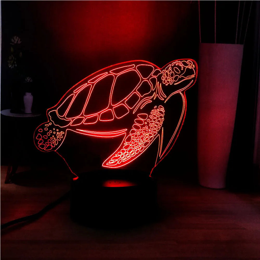 3D acrylic turtle-shaped LED night light showing one of its 16 colour options on a bedroom shelf.
